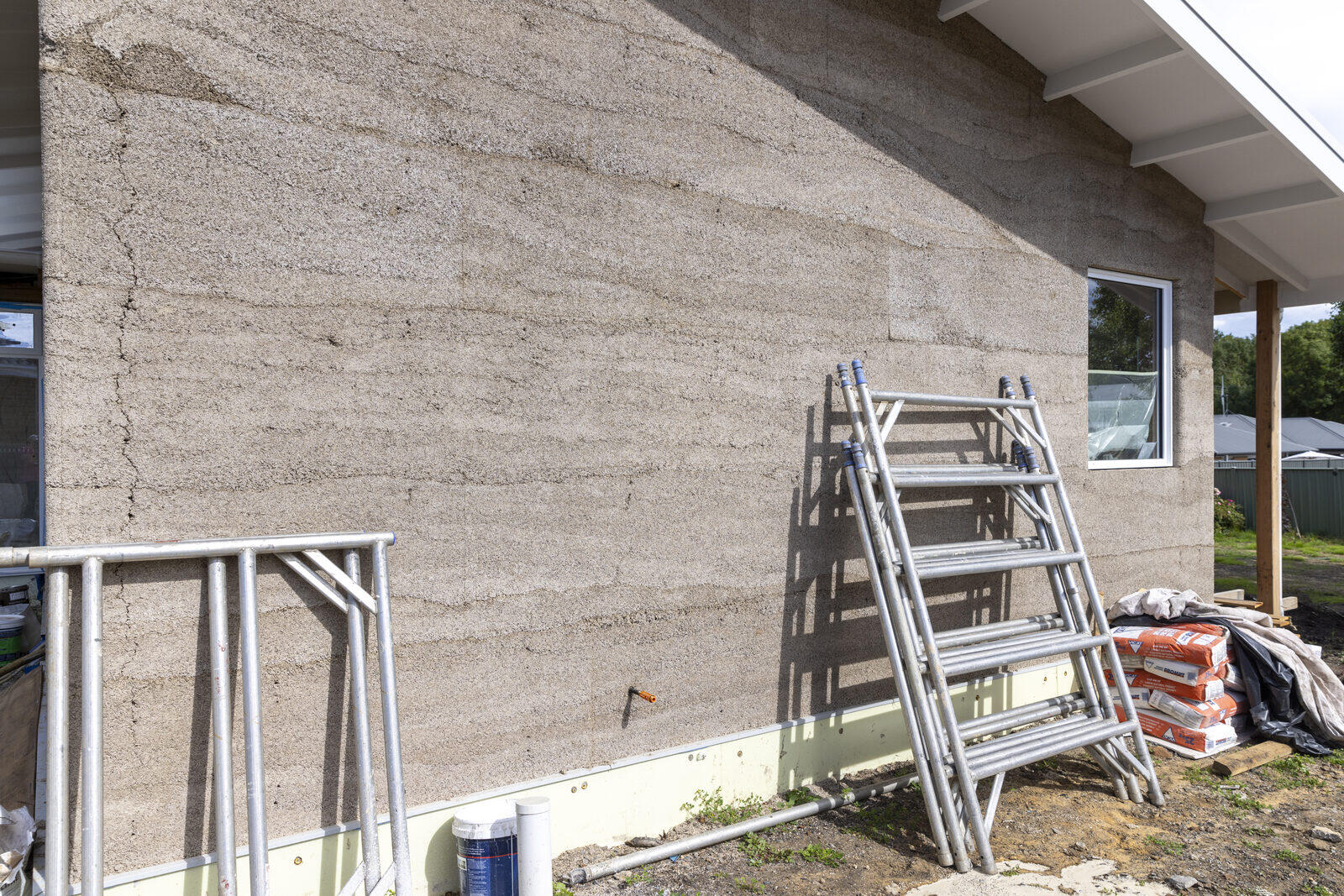 Worker applying sustainable building materials